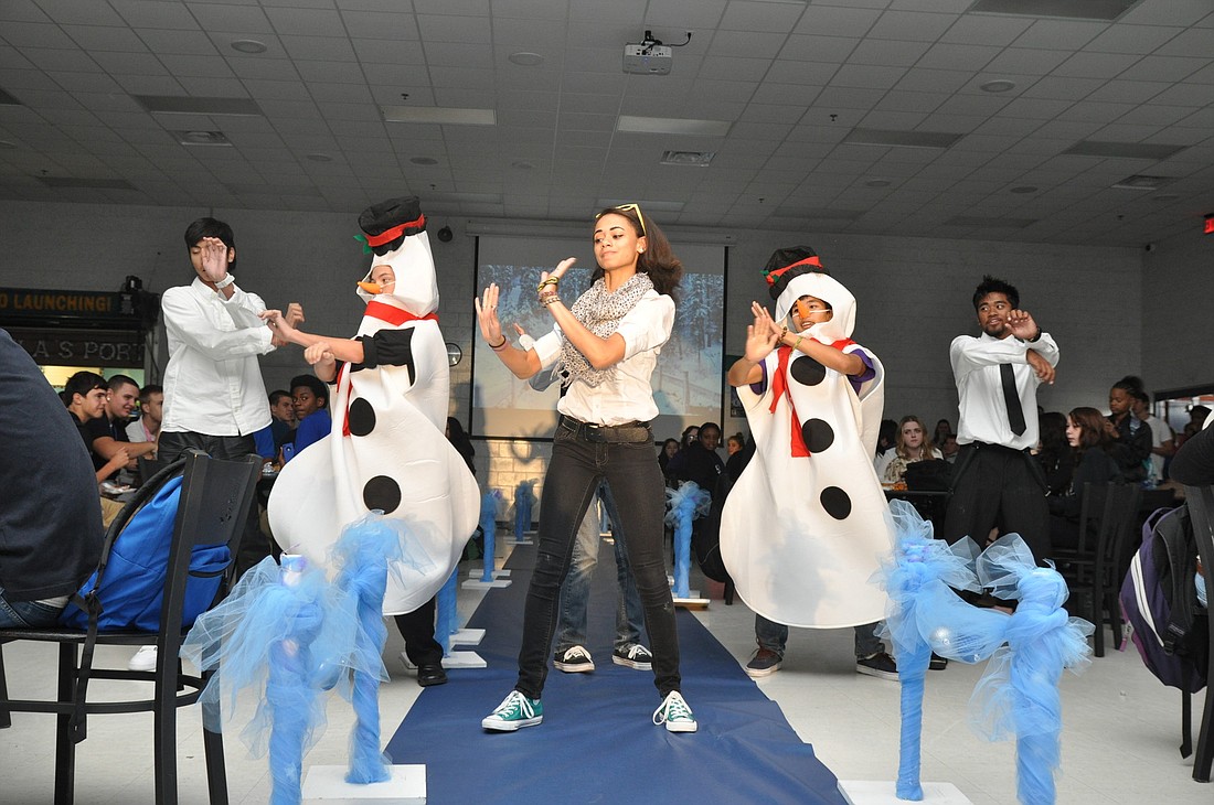 Gabriella Jackman leads a group dance to PsyÃ¢â‚¬â„¢s Ã¢â‚¬Å“Gangnam StyleÃ¢â‚¬Â to begin the fashion show.