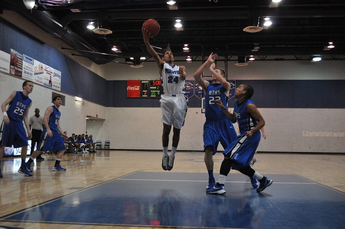 Matanzas senior Lazaro Justize attempts a floater Wednesay night against Bartram Trail. ANDREW O'BRIEN