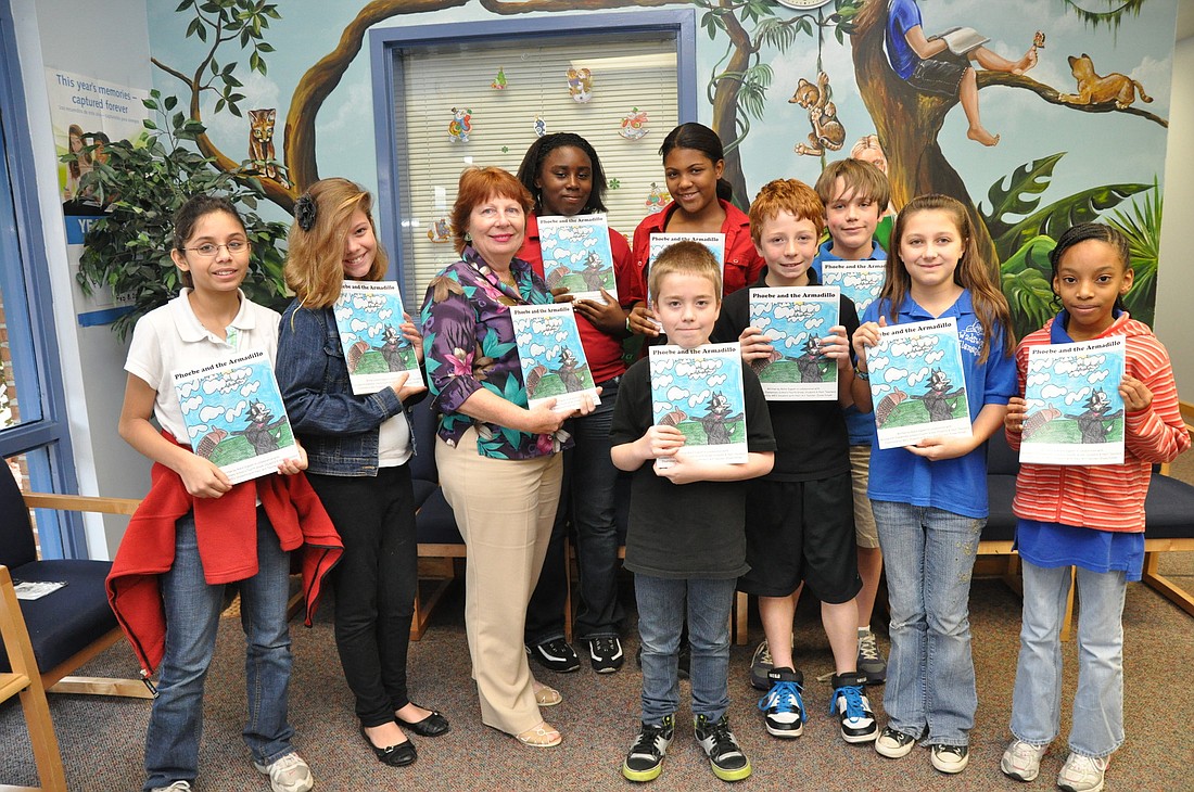 Wadsworth Elementary School Principal Robin DuPont and several fifth-grade students who contributed to the book.