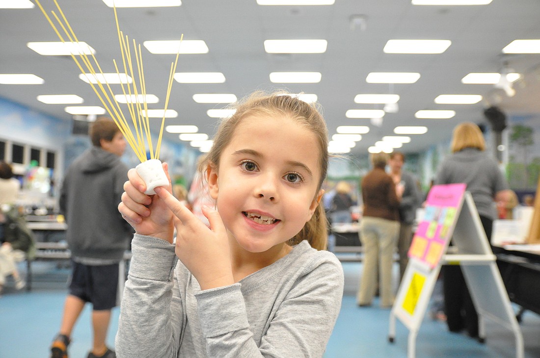 Ruby Dobbs shows of her project at the Old Kings Elementary STEAM Night.