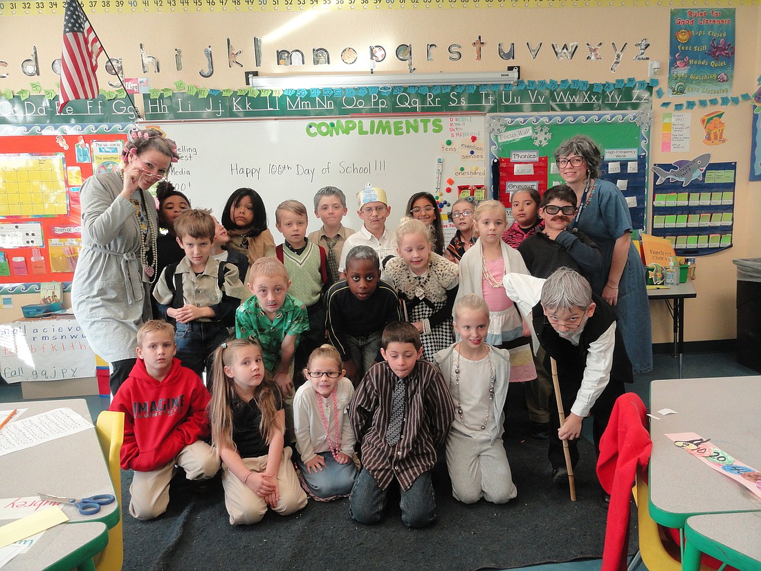 Amy Wollwerth's first-grade class dressed like they were 100.