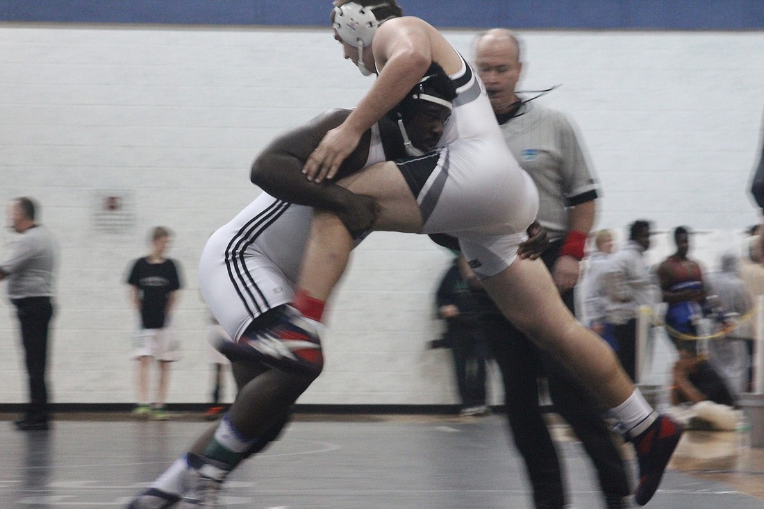 Steven Moseley (left) advanced to this weekend's state finals in the 285-pound weight class. ANDREW O'BRIEN