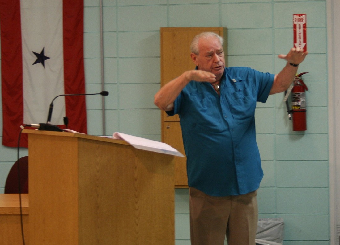 Dick Holmberg presents his plan to save Flagler Beach to city officials and residents.