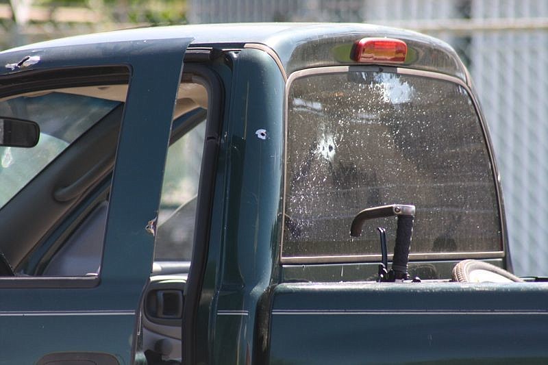 The stolen pickup Bell was driving is marked with bullet holes following the shootout he had with sheriff's deputies.