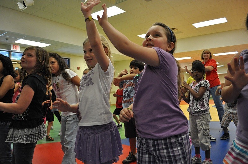 Second-grader Natalie Durazo, right, eagerly performed the warm-up routine.