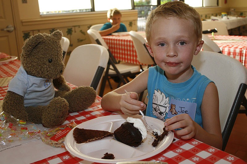 Joe Smillie, 4, shared a piece of cake with his special friend.
