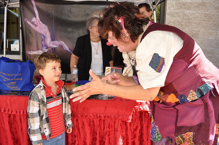 Alex Jodwalis gets a magic lesson from Karen Bell.