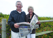 Longboaters Dr. Sid Katz and Elaine Keating read their Longboat Observer while overlooking the Pacific Ocean on Channel Drive in Montecito, California.