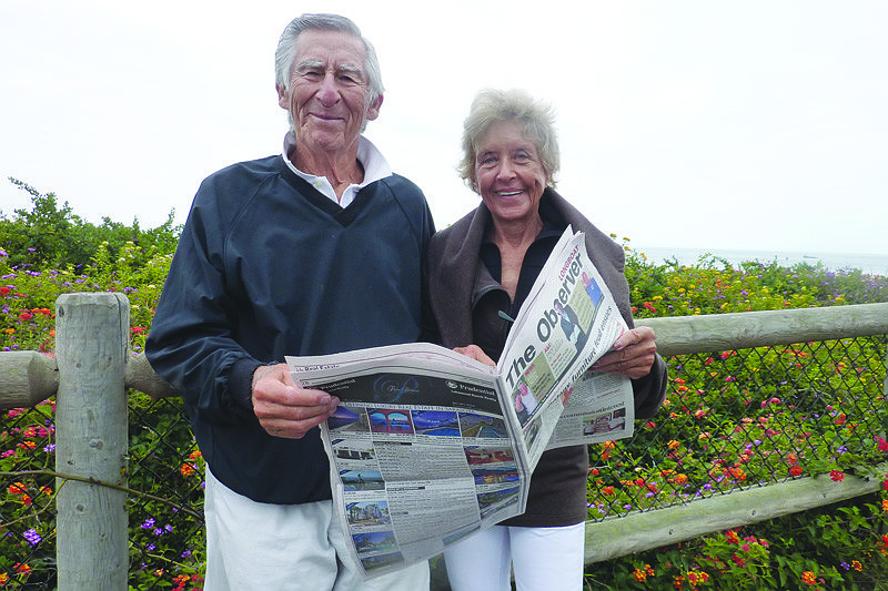 Longboaters Dr. Sid Katz and Elaine Keating read their Longboat Observer while overlooking the Pacific Ocean on Channel Drive in Montecito, California.