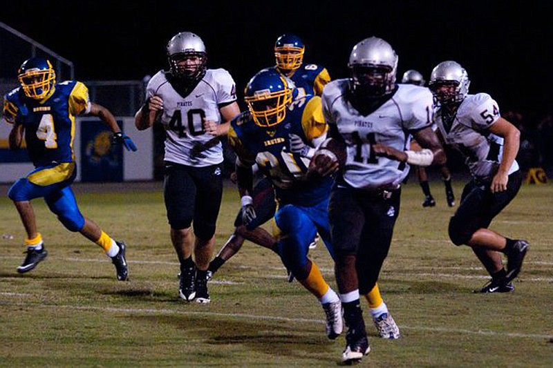 Eric Foster recovers a Bayshore fumble for the Pirates. Photos by Monica Weirich Malley.