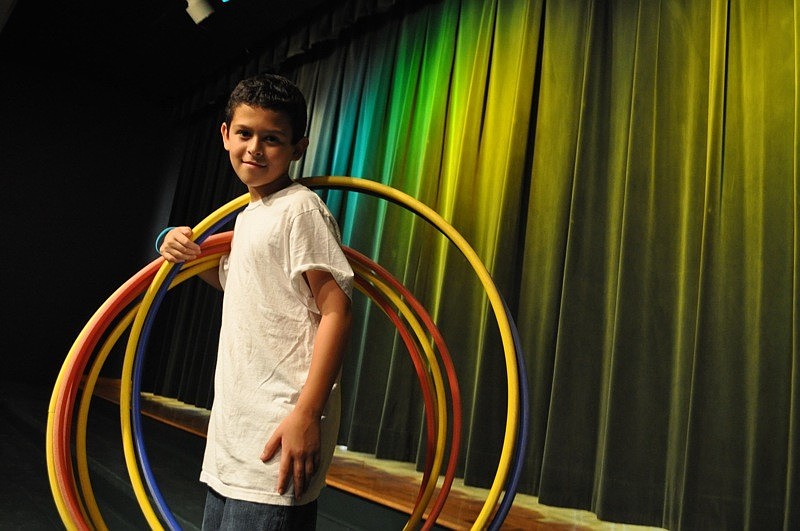 Spencer Rosenstien helped keep the hula-hoops handy for the contest.
