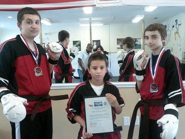 Paul Schettino, Mathias Daza and Anthony Schettino, members of Remix Martial Arts Studio, in Palm Coast, will represent Team USA against Team Canada, in October.