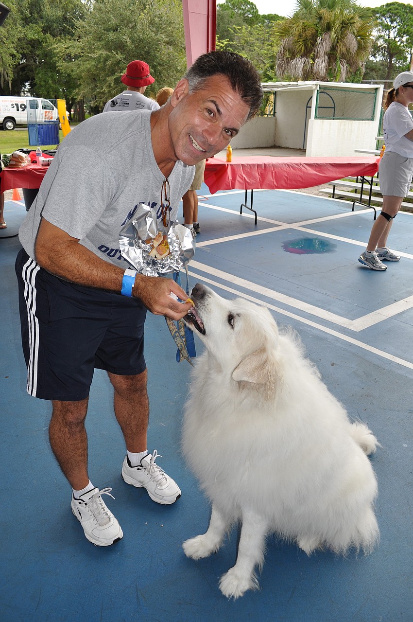 Mark Schiavone shares a treat with Gracie