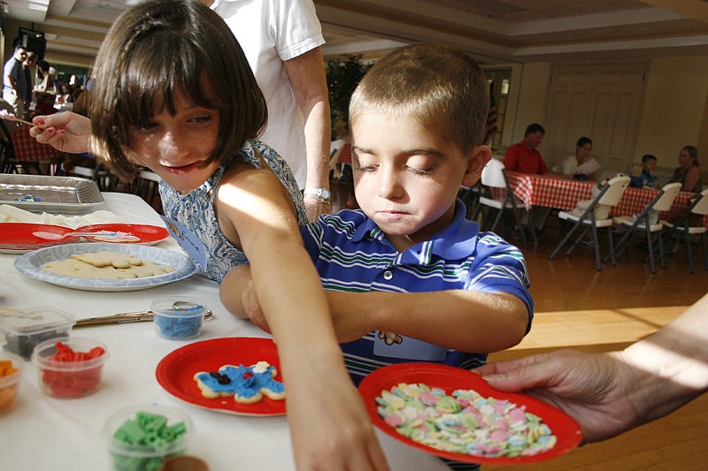 Twins Emma and Grayson Tullio, 7, had a blast creating their own cookies.