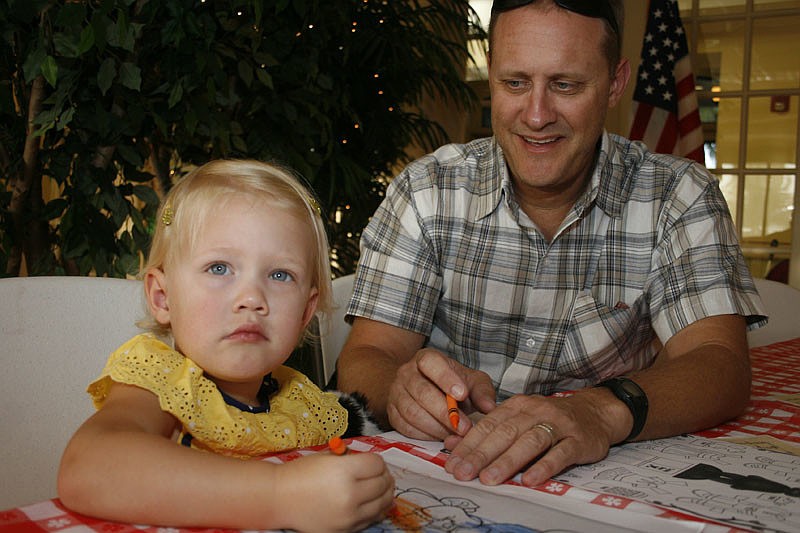 Sara Martin, 2, created some teddy bear artwork with her dad, David.
