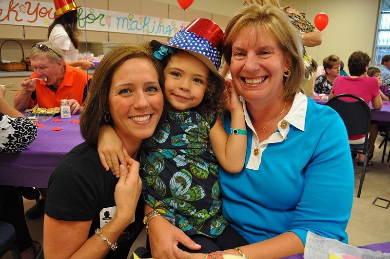 Lilly Lynch enjoyed lunch with her mom Bethany, left, and nanny, Nancy Humphreville.