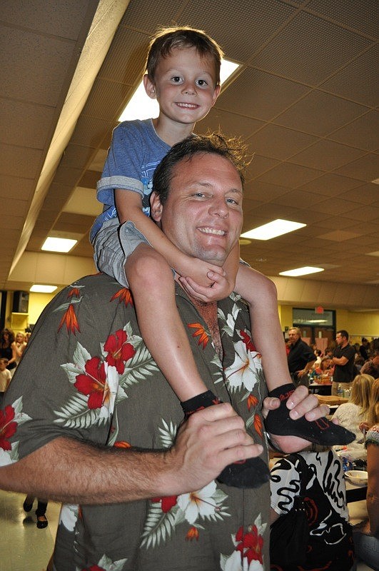 Jake Yost, 5, got a birds-eye view from his dad, Roy.