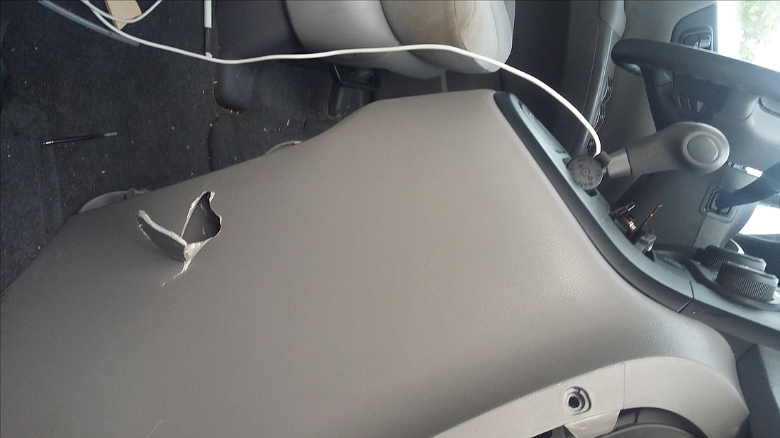 The bullet entered the passenger door went into the console, shown here. Courtesy photos