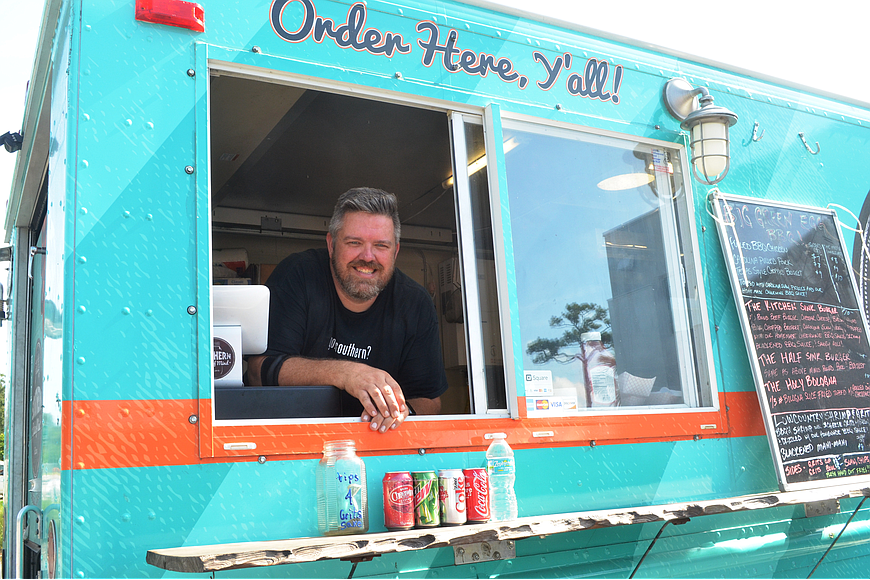  Lee Buckner inside his Southern State of Mind Food Truck. File photo by Wayne Grant