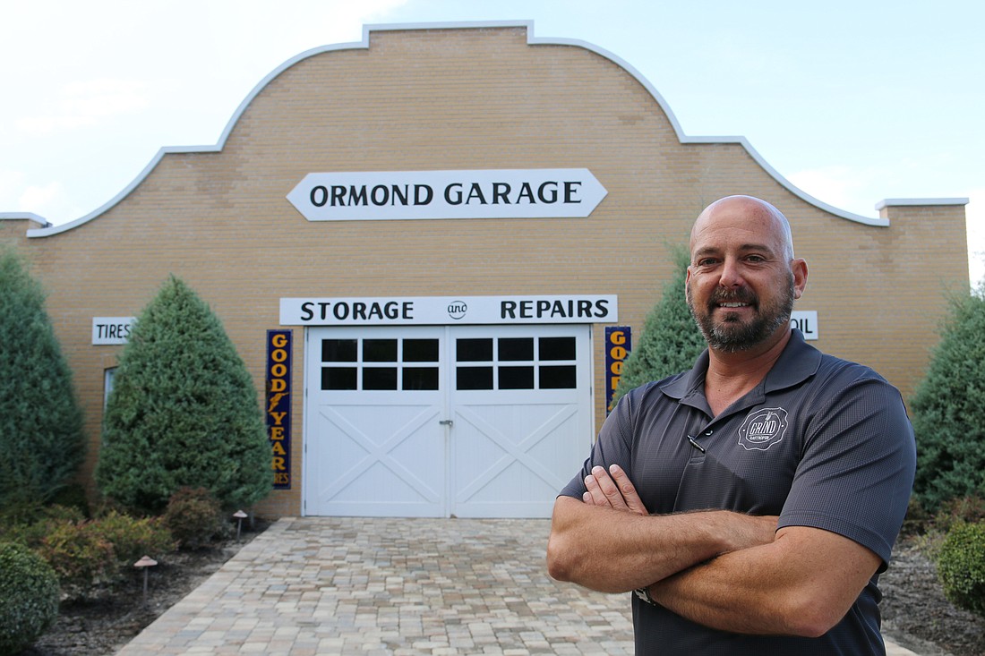 Grind Gastropub owner Kevin Wakefield smiles in front of what will soon be Ormond Garage Brewing. Photo by Jarleene Almenas