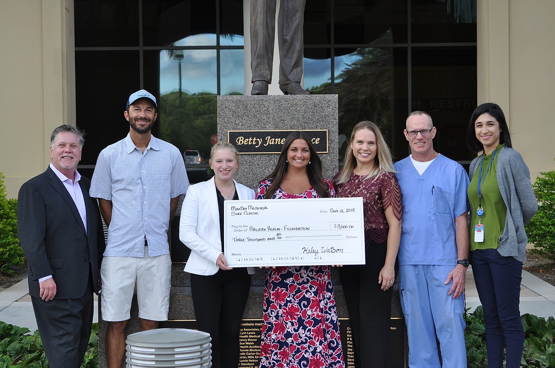 The Halifax Health Foundation received $3,000 from the May Day Memorial Surf Classic. Shown are Preston Root, Nic Stephens, Scenic Root, Haley Michelle Watson, Ashley Dufrene, Richard Powers and Kathryn Nagib. Courtesy photo