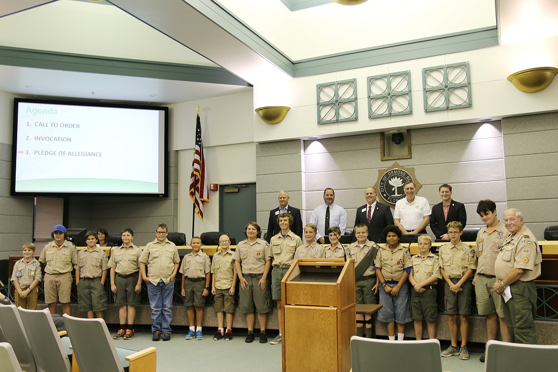 The City Commission smiles with Boy Scout Troop 468 on Oct. 4. Photo by Jarleene Almenas