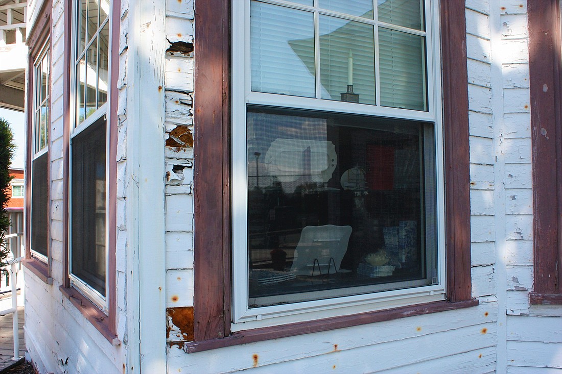 Parts of the siding are broken or missing on the historic MacDonald House. Photo by Wayne Grant