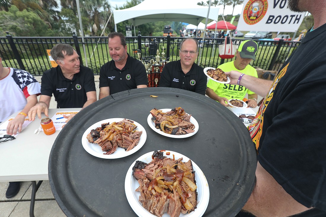 Yes, we judge here. Judges for the amateur division of King of the Grill included Mayor Bill Partington and the City Commission. Photos by Anthony Boccio