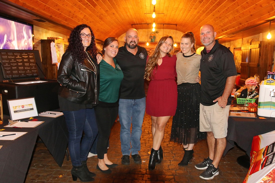 Michelle Mariano, Chelsea Williams, Kevin Wakefield, Kayla Eve, Lisa Williams and Scott Smith at the fifth-annual Giving Thanks at Grind event on Wednesday, Nov. 21. Photo by Jarleene Almenas