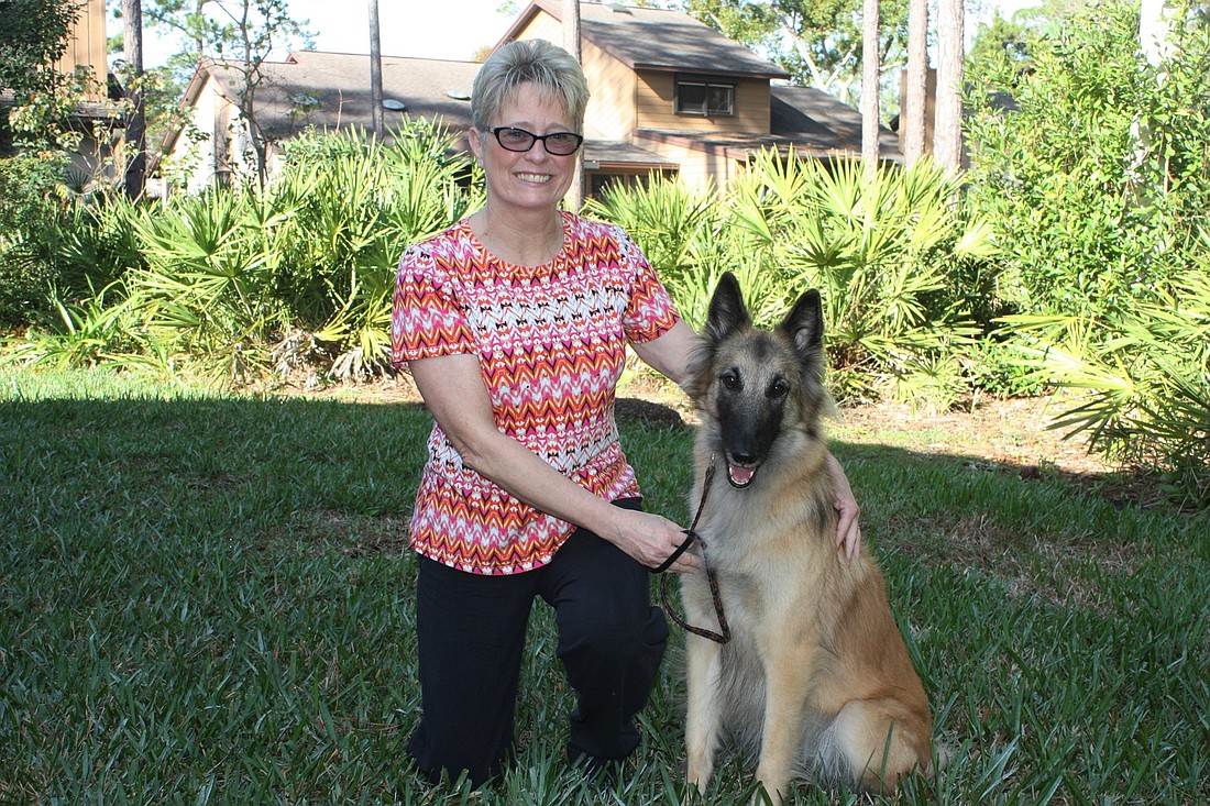 Diane Schultz, shown with Mollie, said dogs enjoy being trained. Photo by Wayne Grant