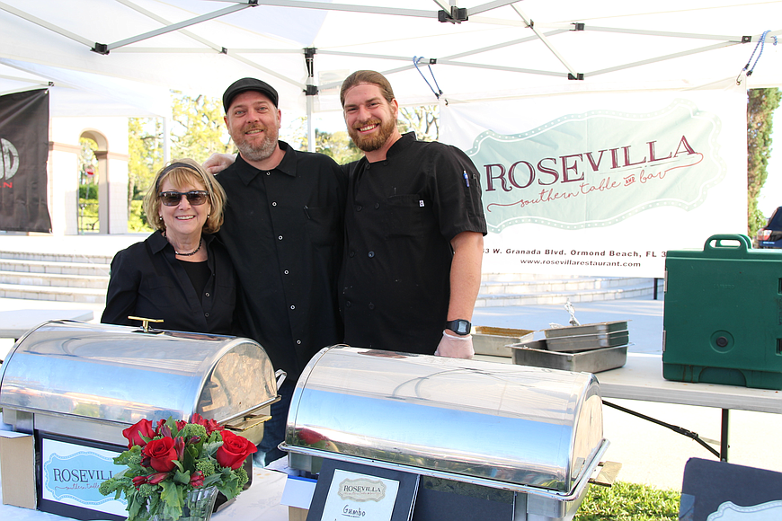 Rose Villa's Cindy Gerow, Greg Shivers and Allen Pruitt smile at their tent during last year's Taste of Ormond event at the Rockefeller Gardens on Sunday, March 4, 2018. File photo by Jarleene Almenas