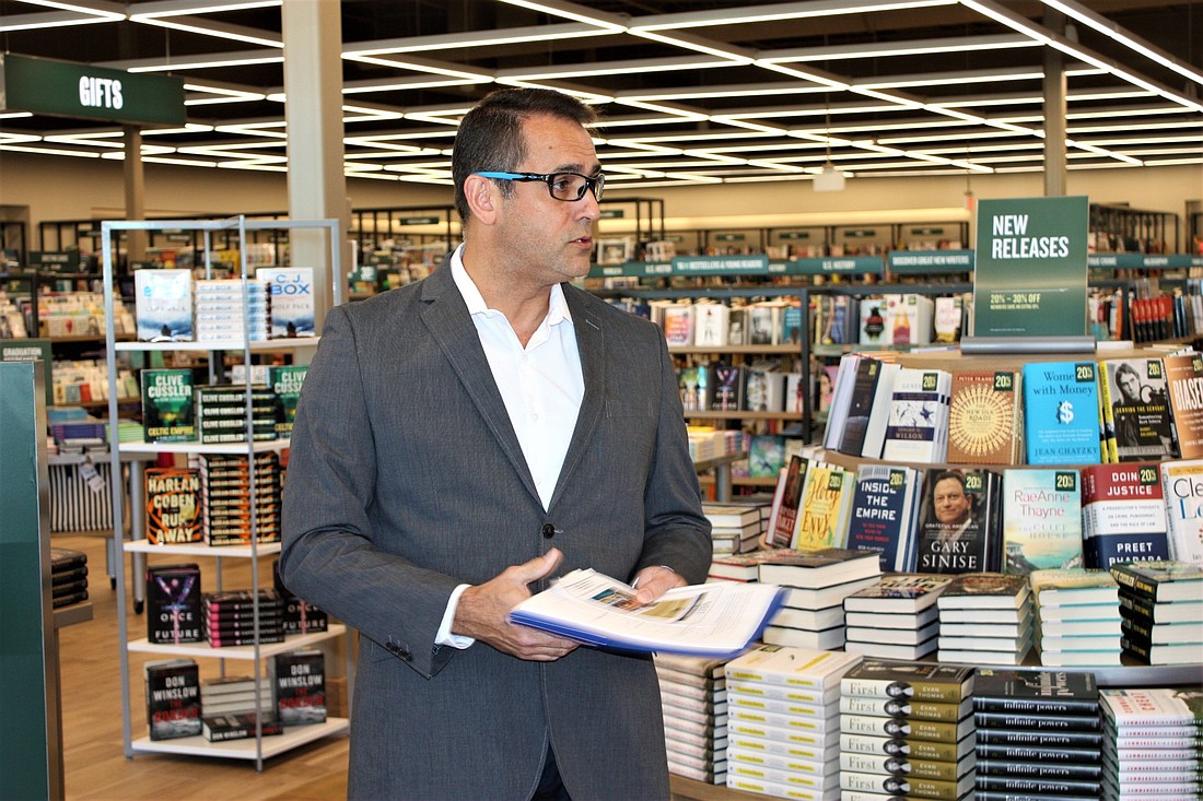 Manager David Michelet shows off the new Barnes & Noble bookstore at Tomoka Town Center. Photo by Wayne Grant