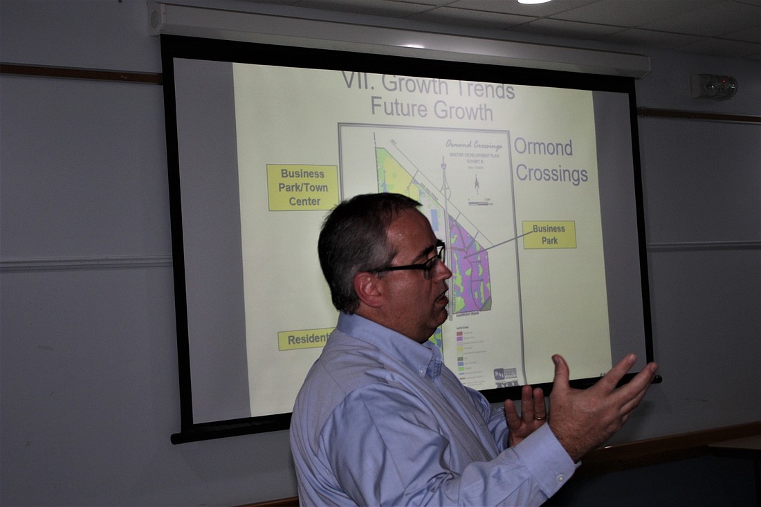 City Planning Director Steven Spraker explains the planning process to a civic group May 8. Photo by Wayne Grant
