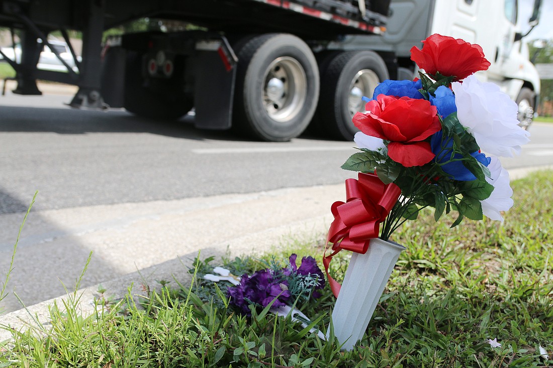 Memorial flowers by a spot near Seminole Drive and West Granada Boulevard mark the recent death of a visually-impaired pregnant woman, who died after being hit by an SUV on Memorial Day. Photo by Jarleene Almenas