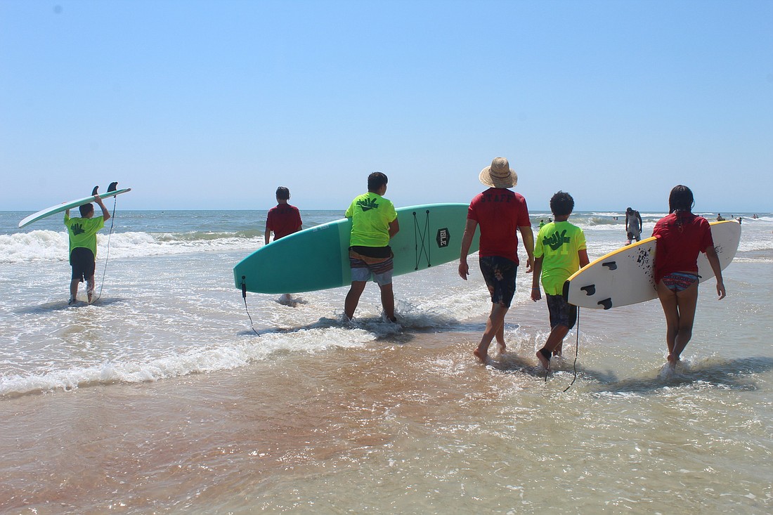 Children surf with Urban Surfing 4 Kids. Photo courtesy of Riverlilly photography