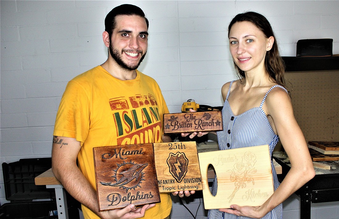 Jacob and Mila Britton have started a woodworking art business. Photo by Wayne Grant