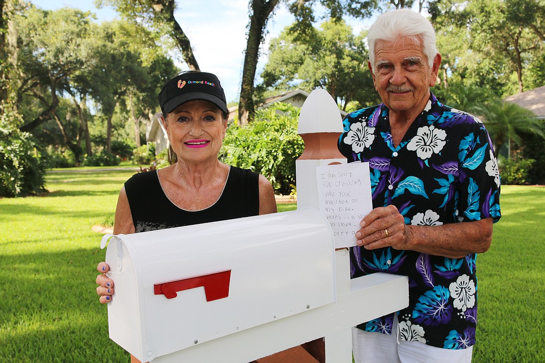 Terri and Ed Kolaska with their new mailbox. Photo by Jarleene Almenas