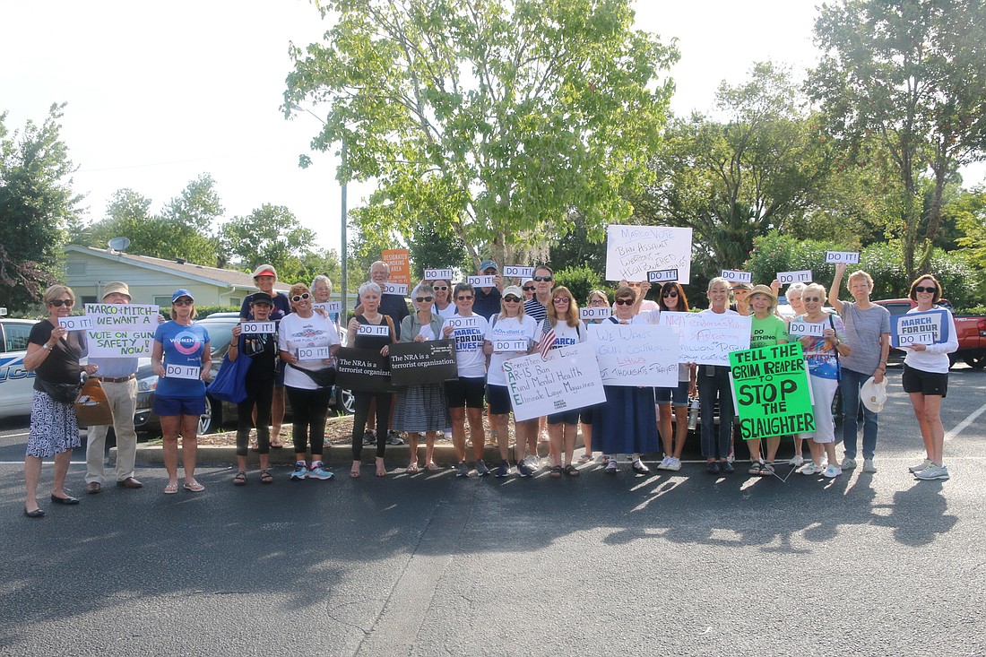 A group of residents pose for a photo outside the Ormond Beach Senior Center where U.S. Sen. Marco Rubio's mobile office hours were held on Thursday, Aug.  8. Photo by Jarleene Almenas