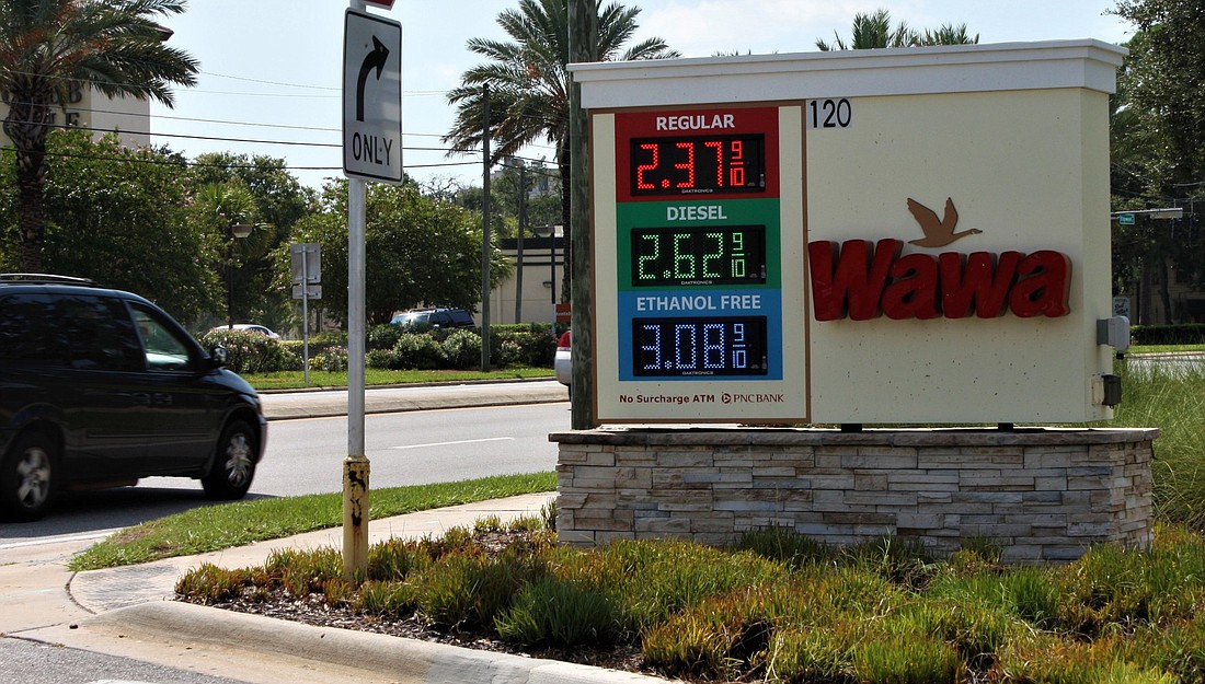 The gas prices glow at a Wawa station on U.S. 1 in Daytona Beach. Photo by Wayne Grant