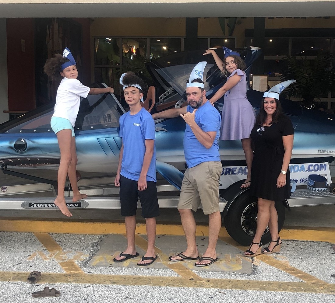 Rob Innes, Kim Barber and the Mako crew pose with the Seabreacher outside Jimmy Hula's. Courtesy photo