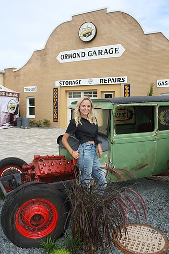 Caley Hayes supplied Ormond Garage Brewing with antique cars that had been restored by her grandfather, Bud Pike. Photo by Wayne Grant