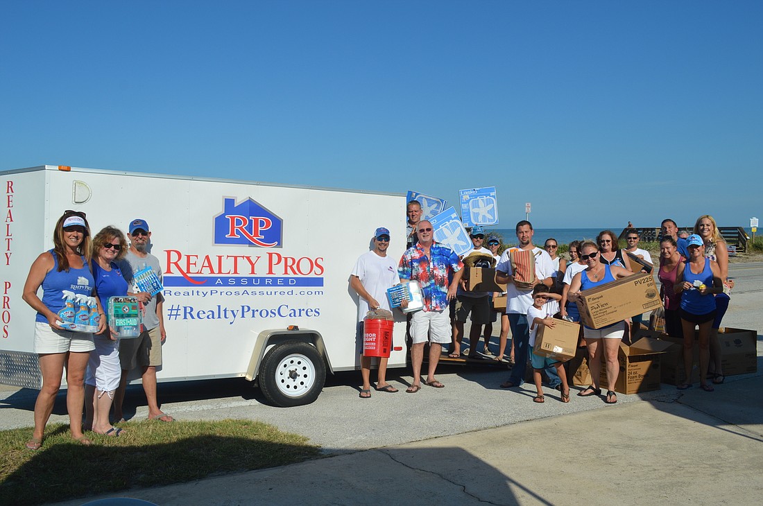 Realty Pros Assured hosted a beach clean-up on Sept. 7. Courtesy photo