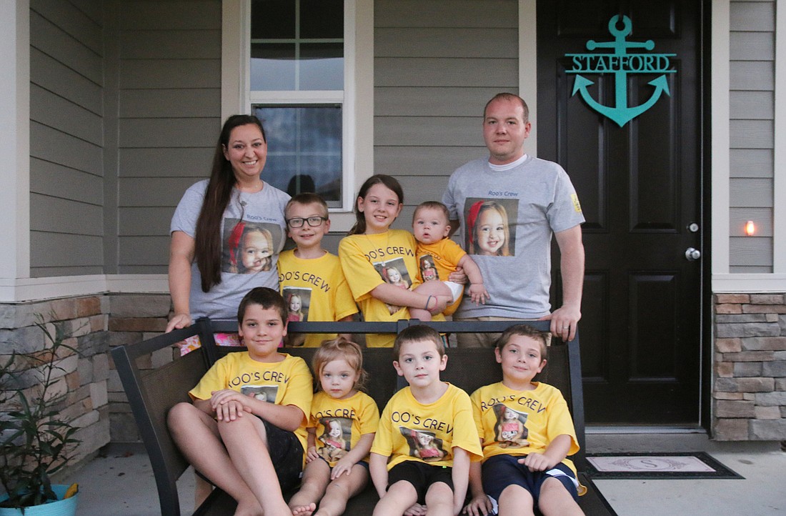 Amanda and Cory Stafford with their children: Eli, Magdalene, Molly, Joshua, Mia, Noah and Zachary. Photo by Jarleene Almenas
