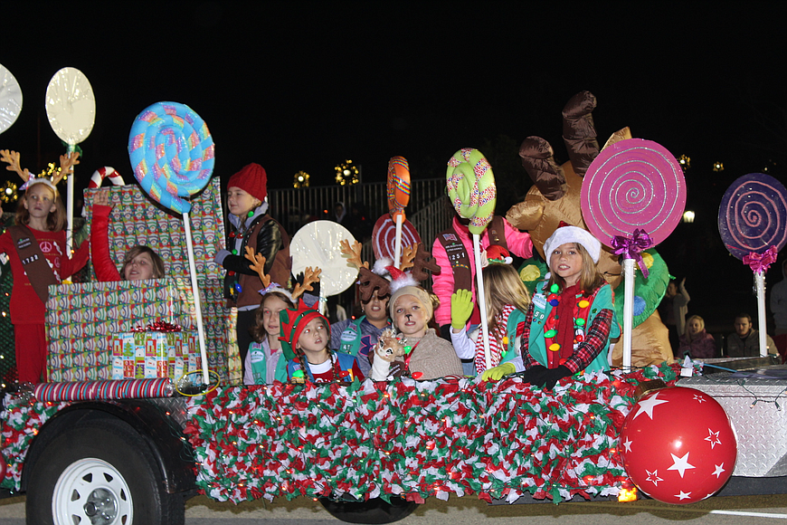 Kids ride in a candy-themed float during the annual Home for the Holidays parade in Ormond Beach in 2017. File photo by Jarleene Almenas