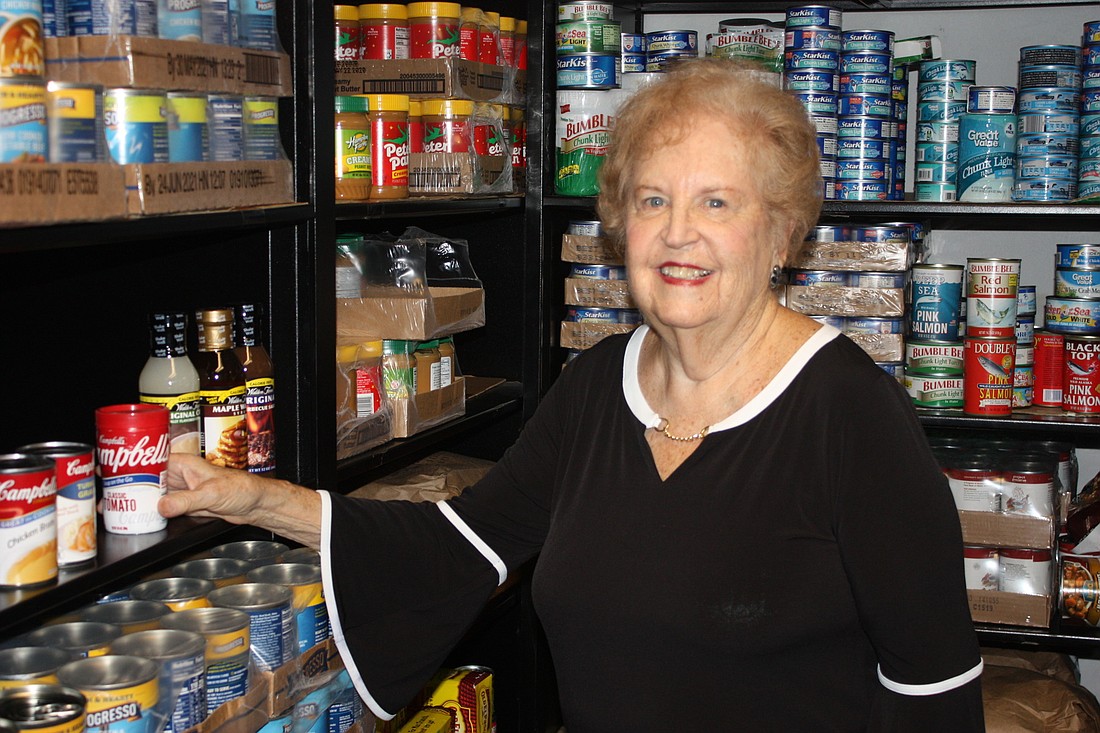 Marta Weisberg volunteers for the Jerry Doliner Food Bank. Photo by Wayne Grant