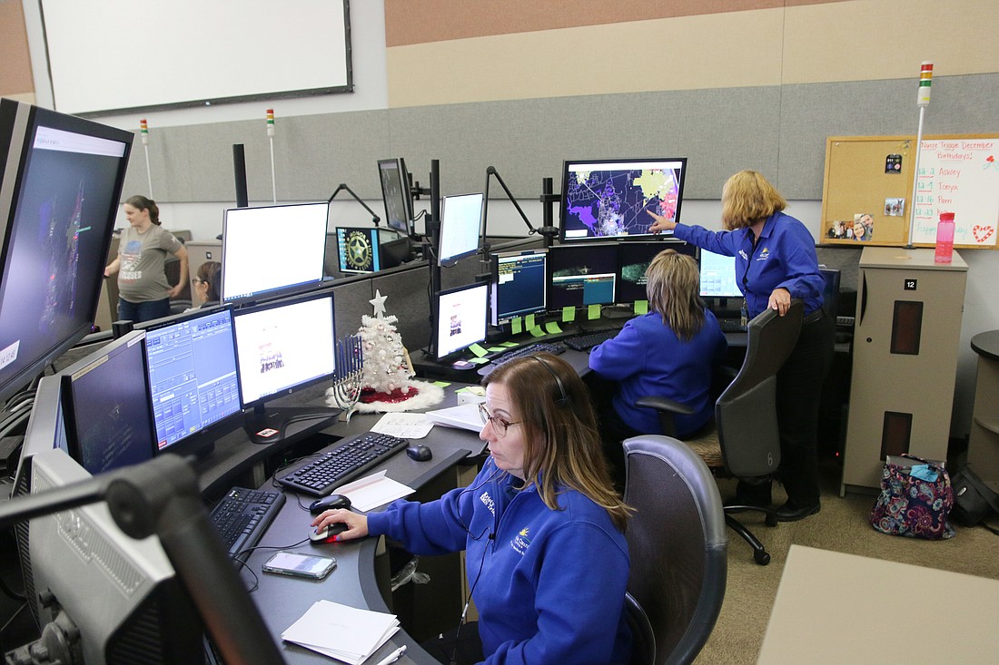 Triage nurses Kristy Butwinick, Tonya Mangus and Pam Cawood in the 911 dispatch center. Photo by Jarleene Almenas