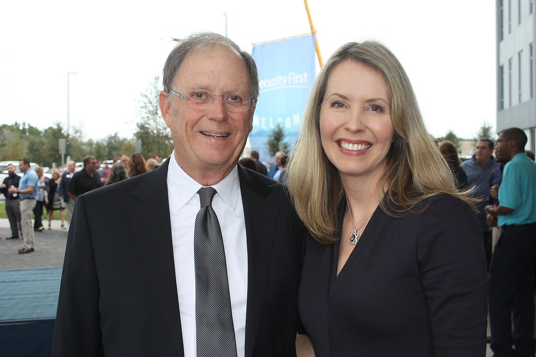Locke Burt and Melissa Burt DeVriese at the grand opening of the Security First building. Photo by Wayne Grant