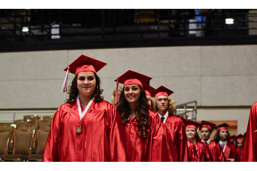 The first wave of Seabreeze students make their way to their seats for the start of the 2018 graduation ceremony. File photo by Ray Boone
