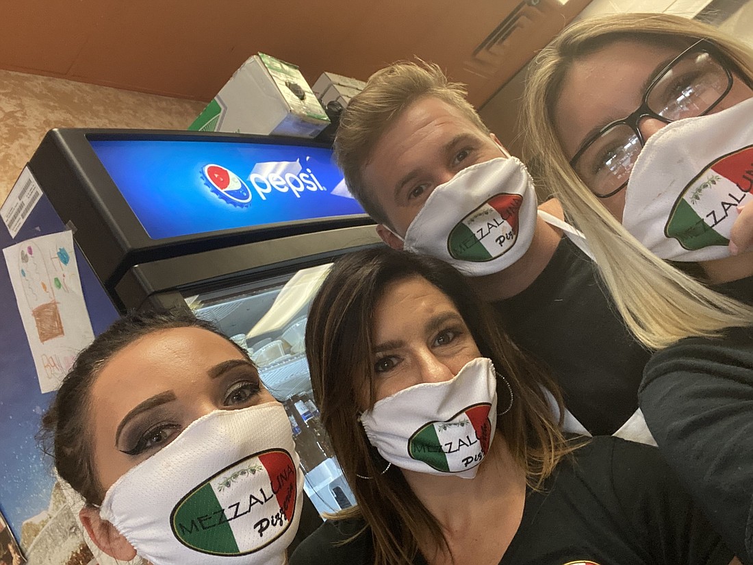 Mezzaluna's Kim Doroski, Gina DiBitetto, Avery Throne and Karissa McWilliams show off their custom face coverings. Courtesy photo