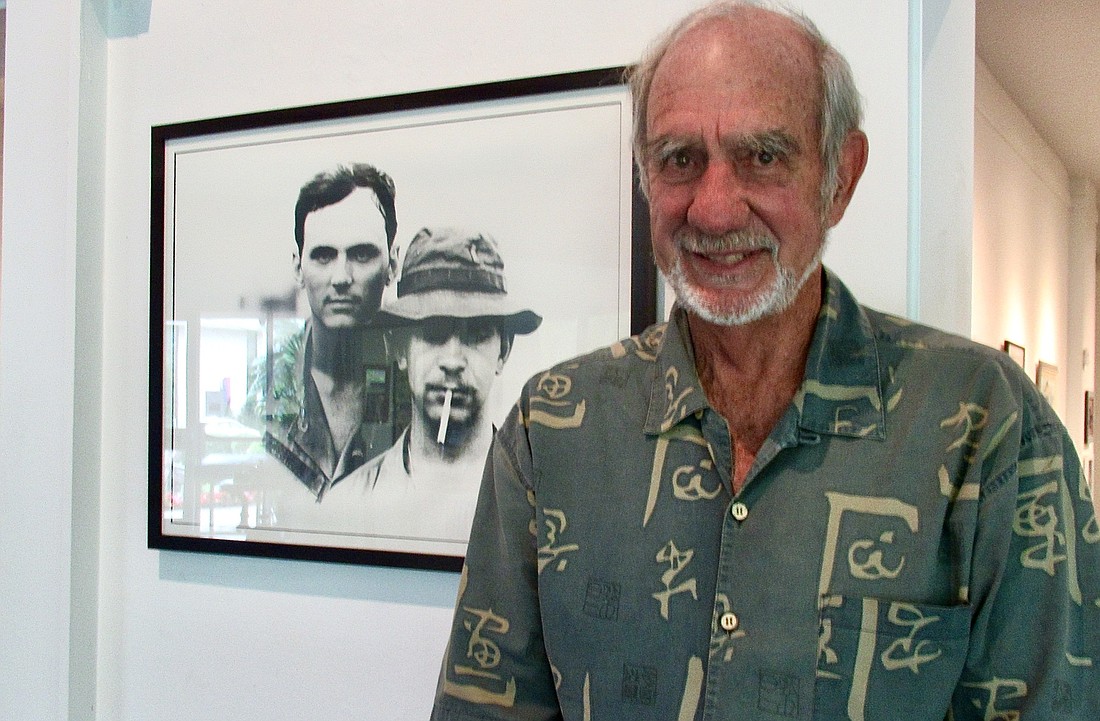 J. Walker Fischer stands by his photograph, "Lieutenants," taken in 1971. Photo courtesy of J. Walker Fischer
